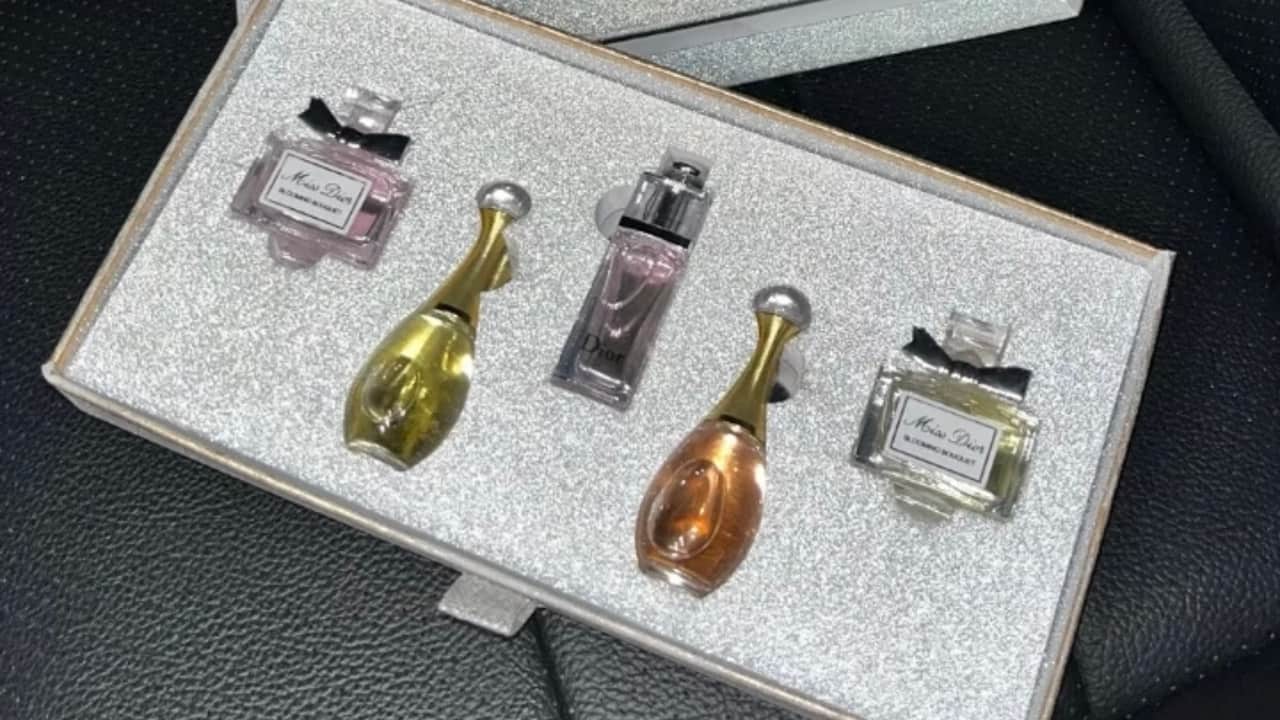 Resin Sticker vs Nickel Sticker for Luxury Perfume Logo Decoration